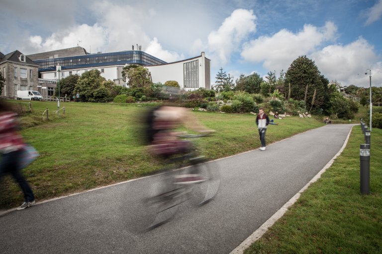 Bike riding through Penryn campus